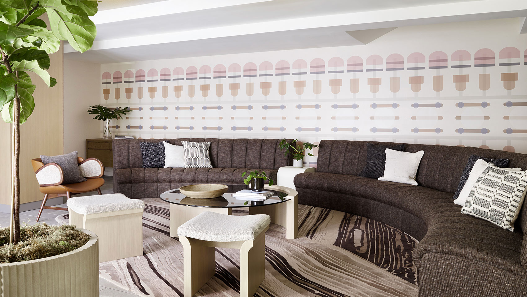 Rounded couch, coffee tables, chair and stools in Enso lobby